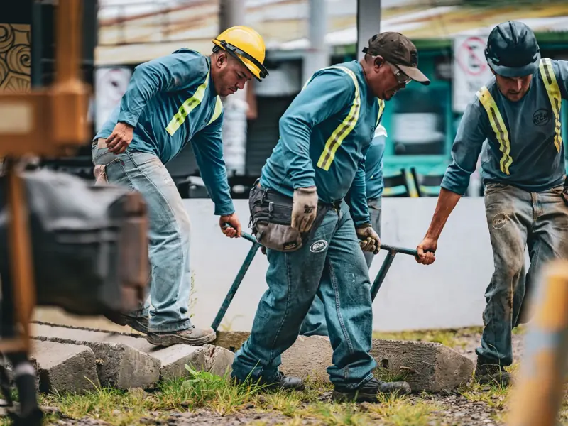 Team of construction workers collaborating on a project in San José, Costa Rica.
