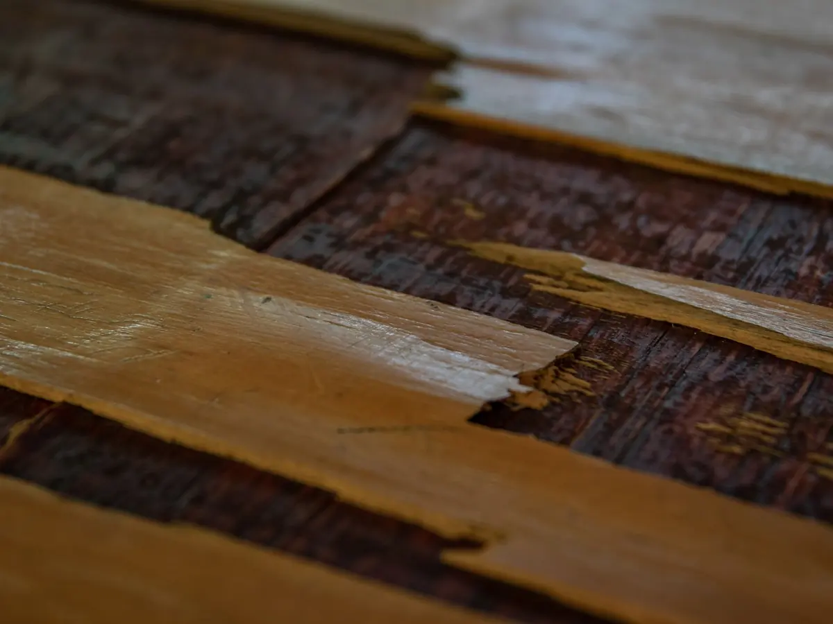 Detailed image showcasing rustic wooden floorboards with a worn, aged look.