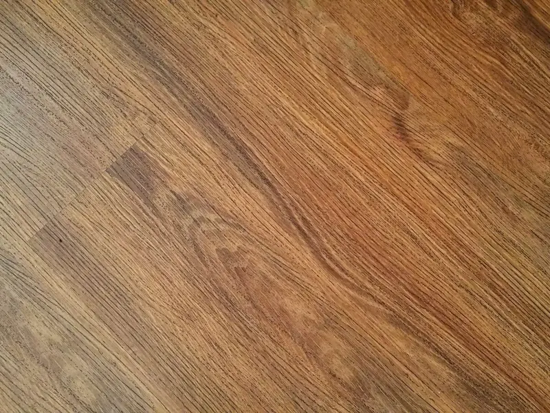 Detailed image of rustic wooden flooring with visible wood grain texture.