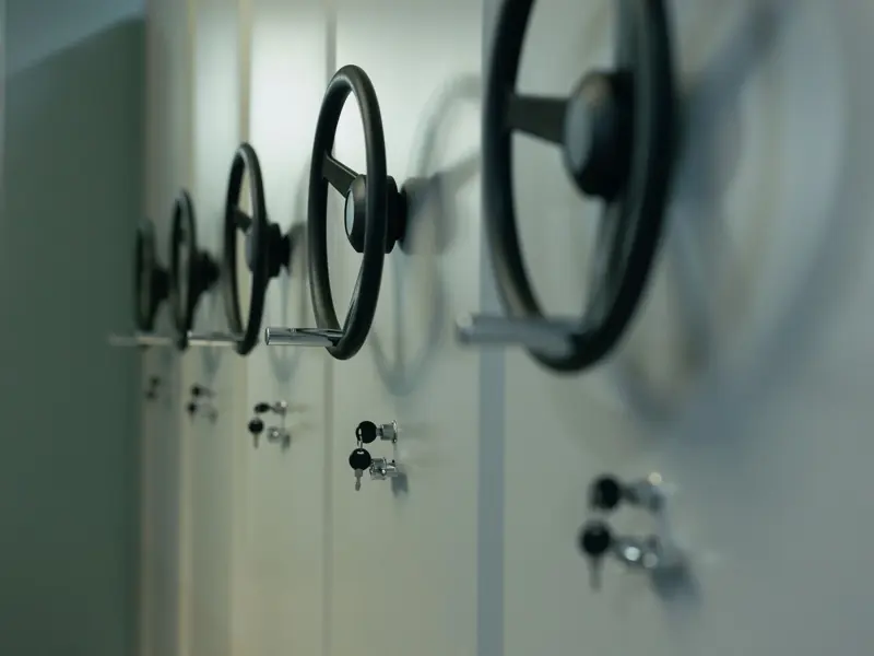 Close-up of industrial safes with manual locks and keys, highlighting security features.